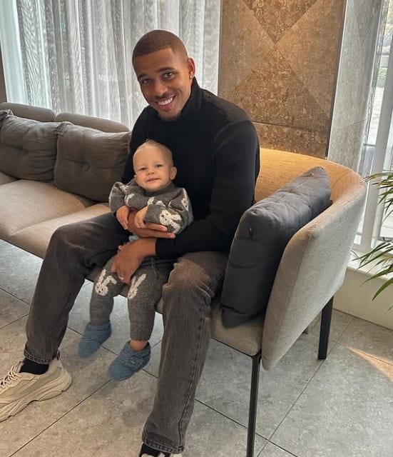 Kevin Njie with his son