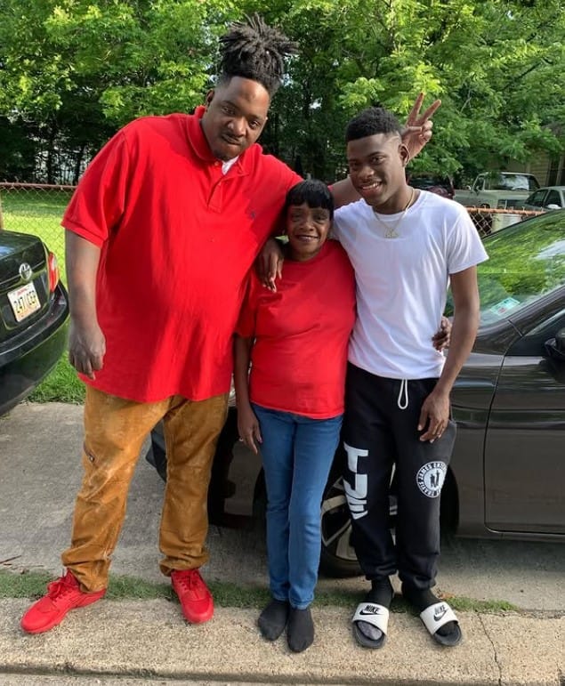 Travis Badass with his mother and friend