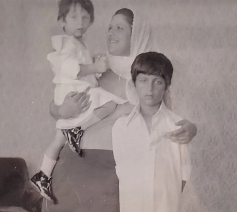 Mehmet Demirkol's childhood image with his mom and brother
